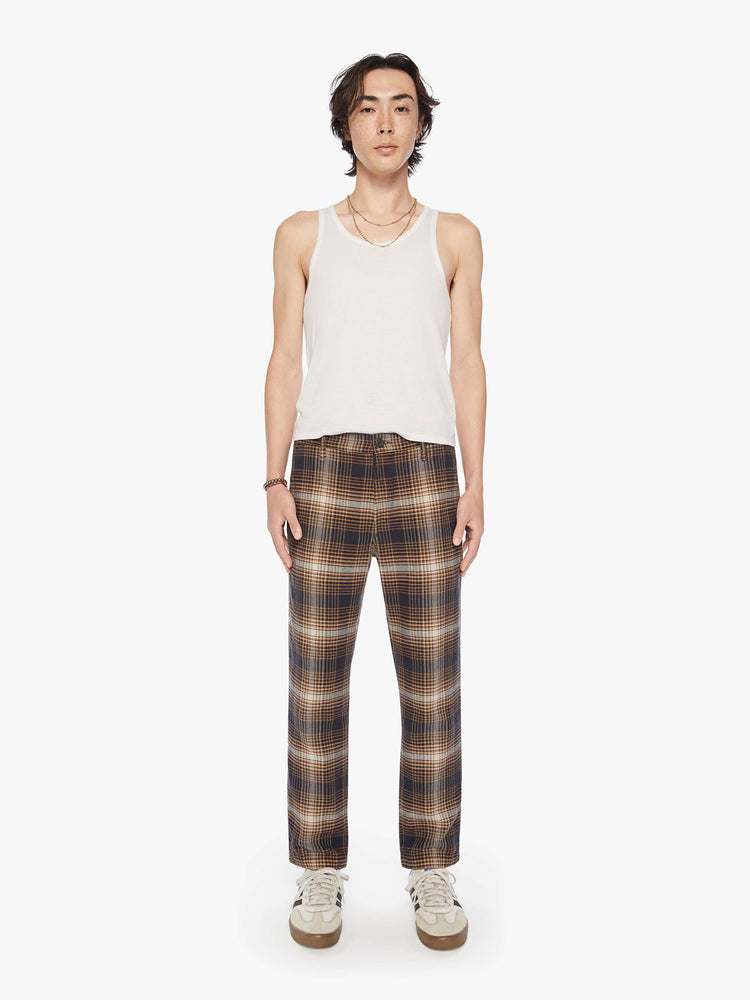 Front view of a mens classic pant with slash pockets and a relaxed, slim-straight leg in a vintage-inspired navy, white and orange plaid print.