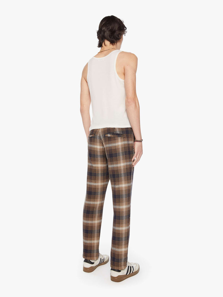 Backview of a mens classic pant with slash pockets and a relaxed, slim-straight leg in a vintage-inspired navy, white and orange plaid print.