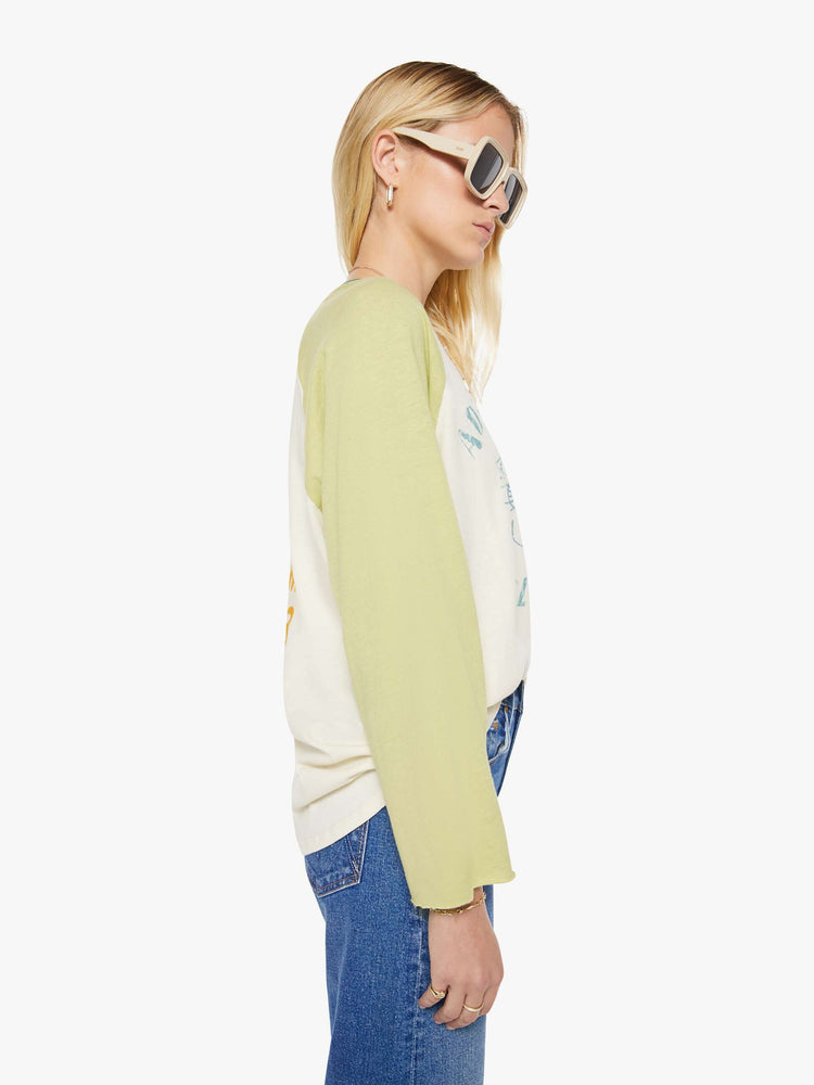 WOMAN side view in baseball tee with a crew neck, 3/4-length frayed sleeves and a curved hem.