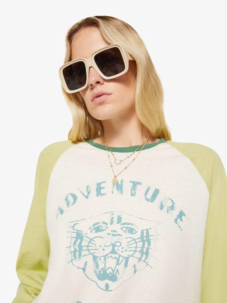 WOMAN close up view in baseball tee with a crew neck, 3/4-length frayed sleeves and a curved hem.