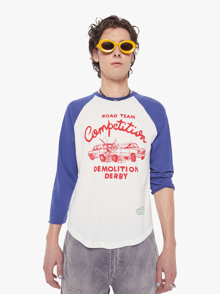 MEN front view in a  baseball tee with a crew neck, 3/4-length frayed sleeves and a curved hem in white with blue sleeves and a red demolition derby graphic on the front.