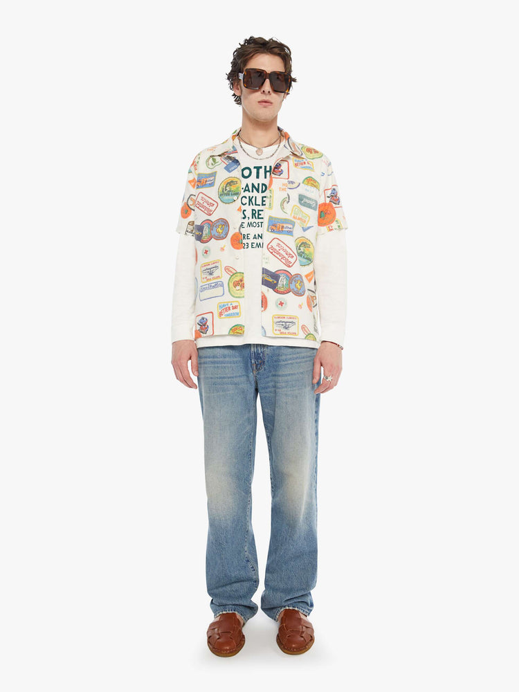 MEN full body view of an off-white with faded patches printed throughout short sleeve button-up with a patch pocket.