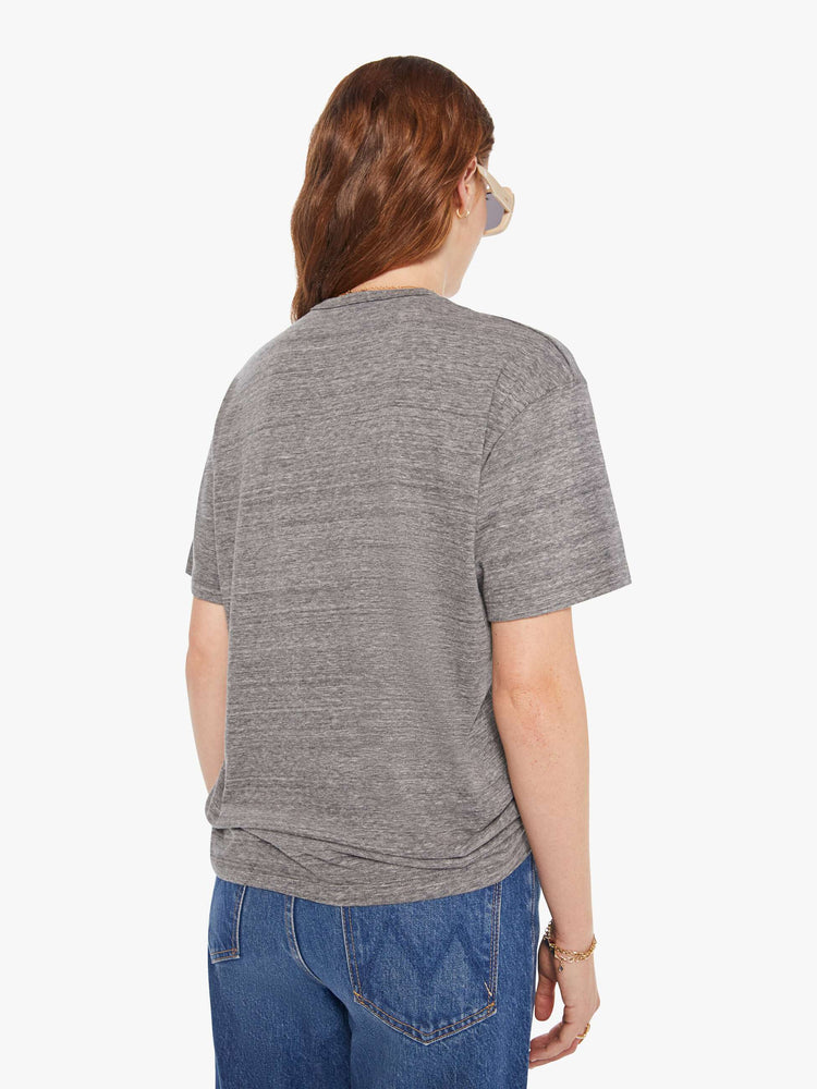 WOMEN back view of a woman in a heather grey unisex crew neck tee featuring a faded blue graphic of hands of the words "HIGHER HOPES".