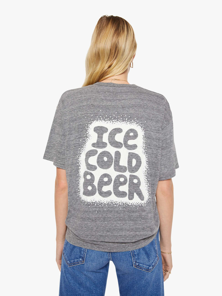 WOMAN back view in a heathered grey tee with a neon orange liquor store graphic on the front.