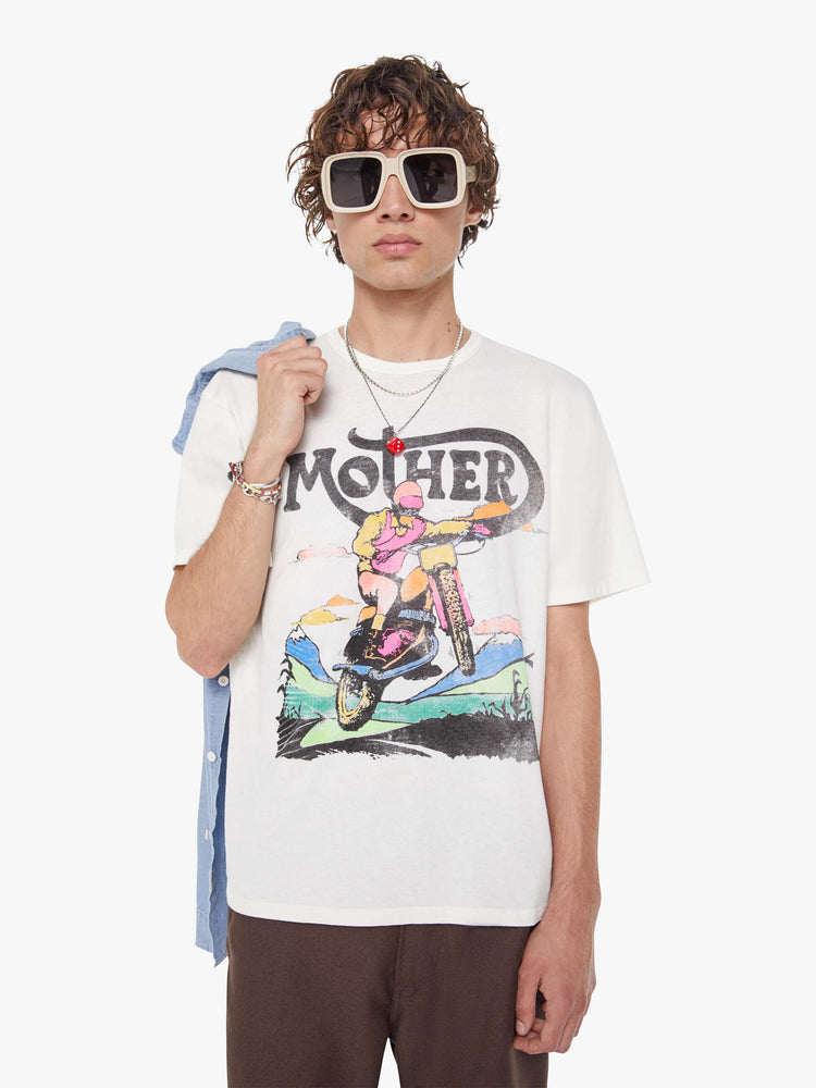 MEN front view in white oversized tee features a faded biker graphic and MOTHER's name in black on the front.