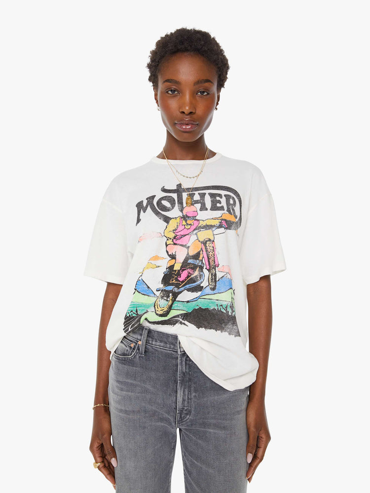 WOMAN front view in white oversized tee features a faded biker graphic and MOTHER's name in black on the front.