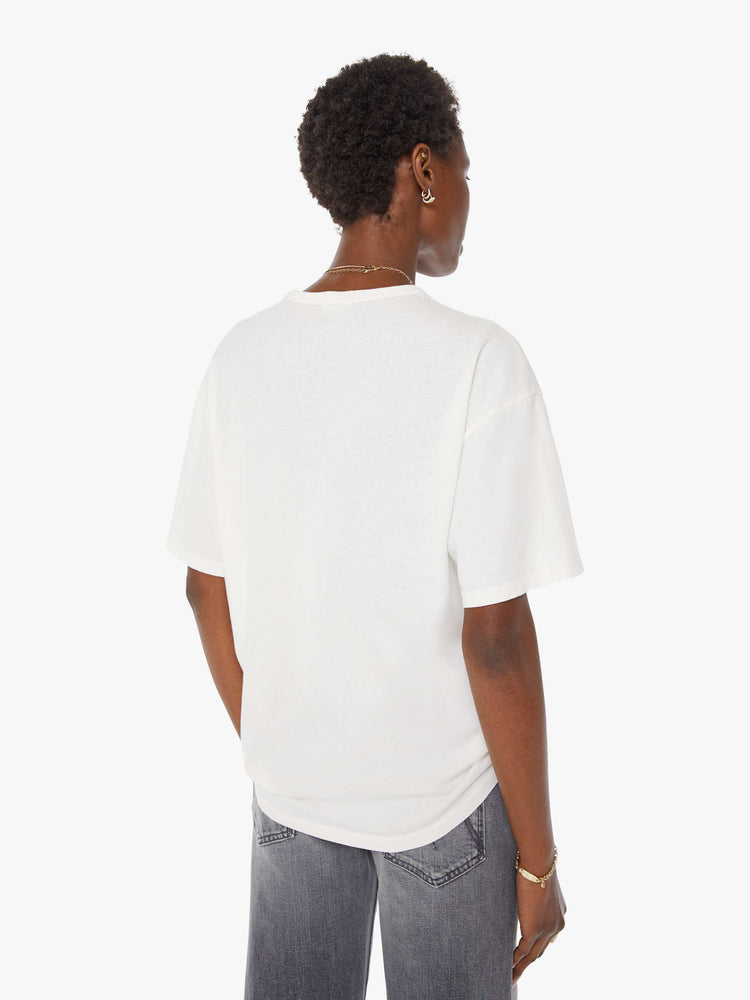 WOMAN back view in white oversized tee features a faded biker graphic and MOTHER's name in black on the front.