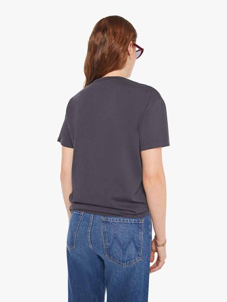 WOMAN back view of an oversized tee in faded black with a tiger graphic with text in red and blue on front.