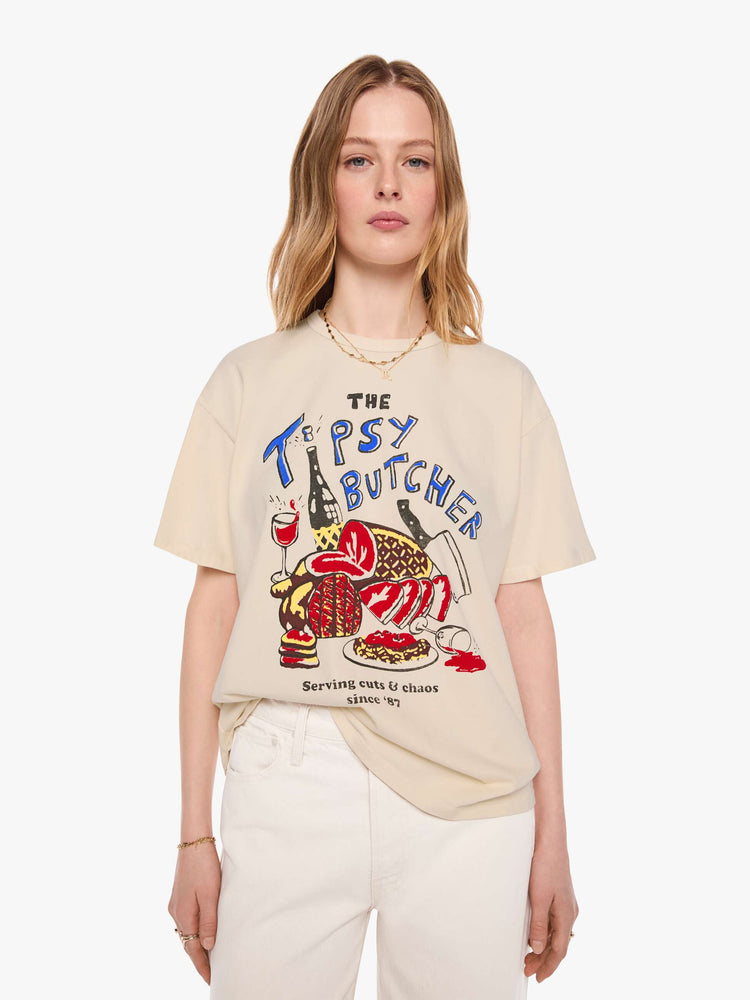 WOMAN front view in a cream tee features a vintage-inspired butcher-shop graphic on the front.