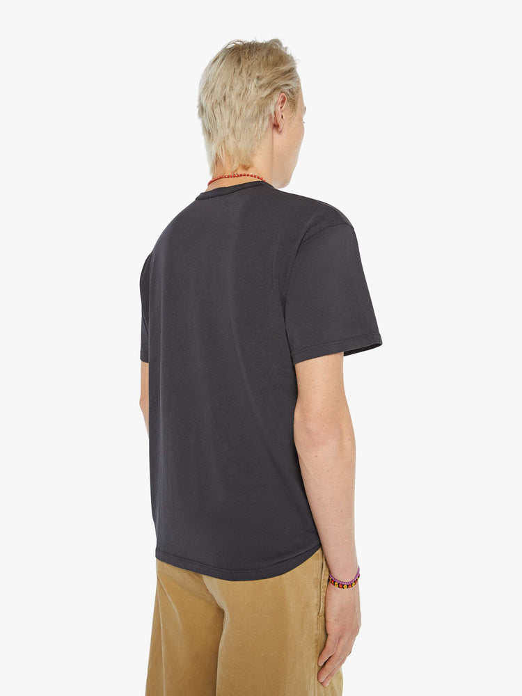 MEN back view in a faded black oversized tee with a faded graphic inspired by vintage camp store merch.