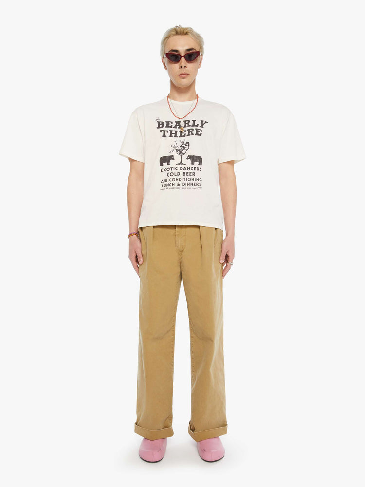 MEN full body view of an oversized tee in off-white with a faded black graphic inspired by a Lake Tahoe club.