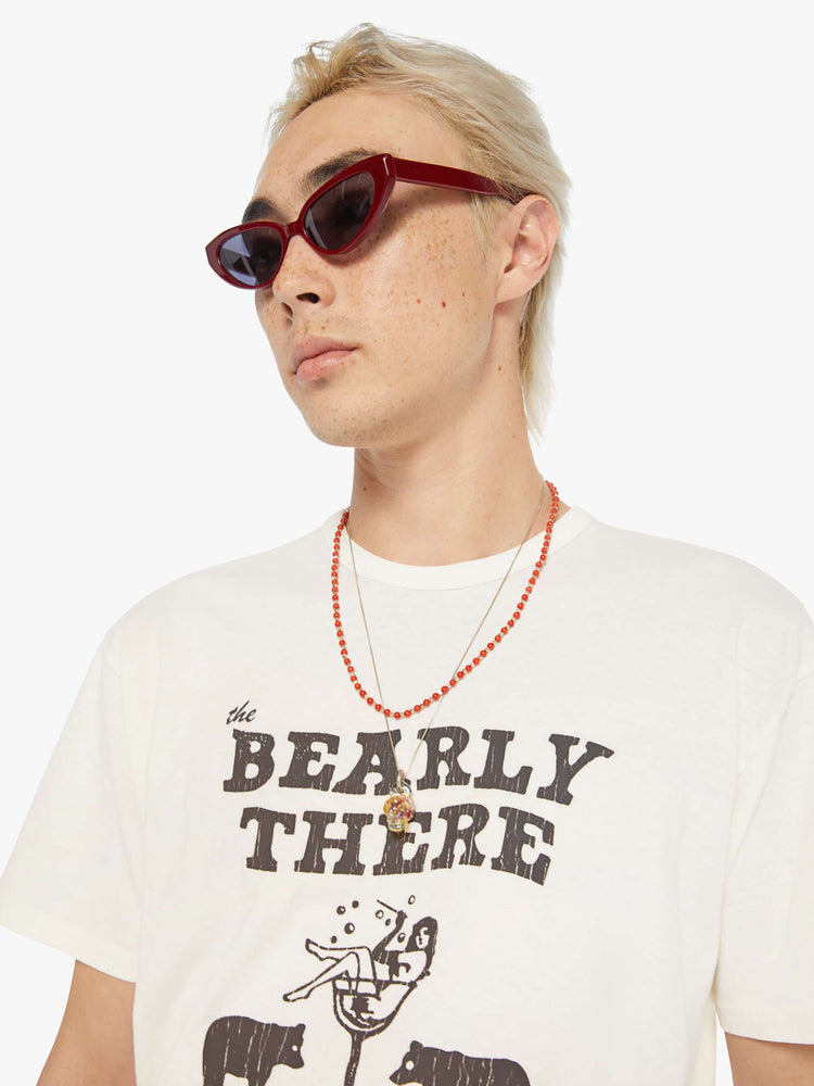 MEN close up view of an oversized tee in off-white with a faded black graphic inspired by a Lake Tahoe club.