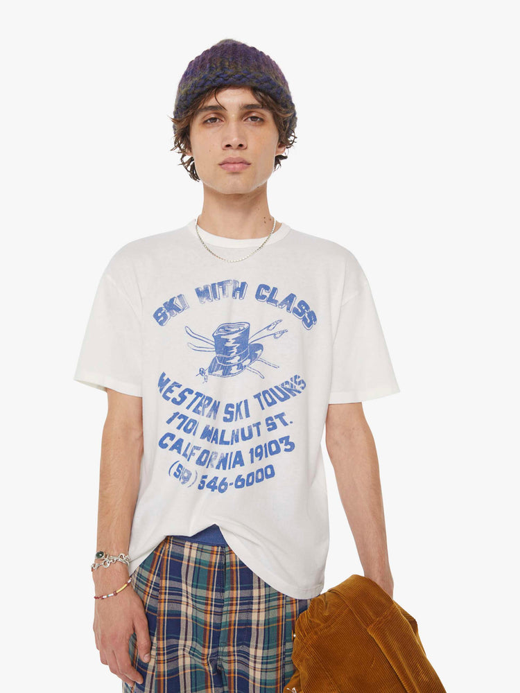 MEN view in a white tee features a faded graphic inspired by a retro ski school on the front.