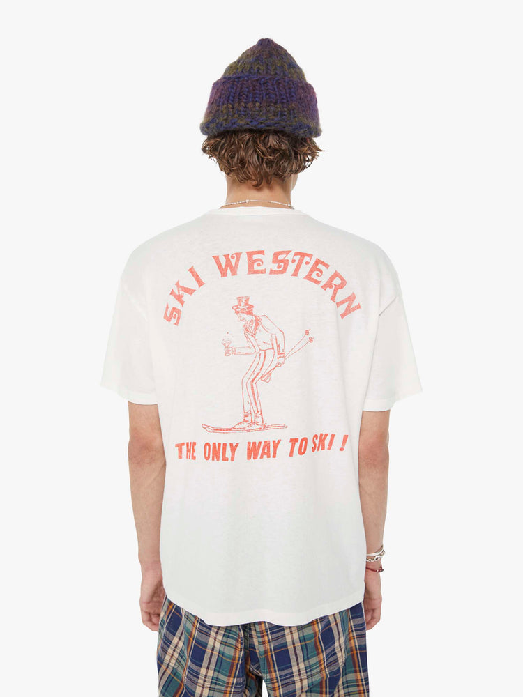 MEN back view in a white tee features a faded graphic inspired by a retro ski school on the front.