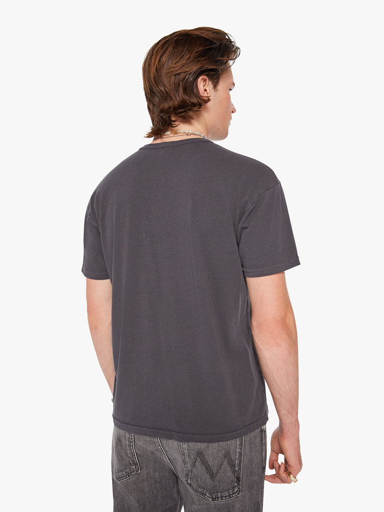 Back view of a men oversized tee with drop shoulders and a loose fit in a dark grey hue with a menu of illicit substances on the front.