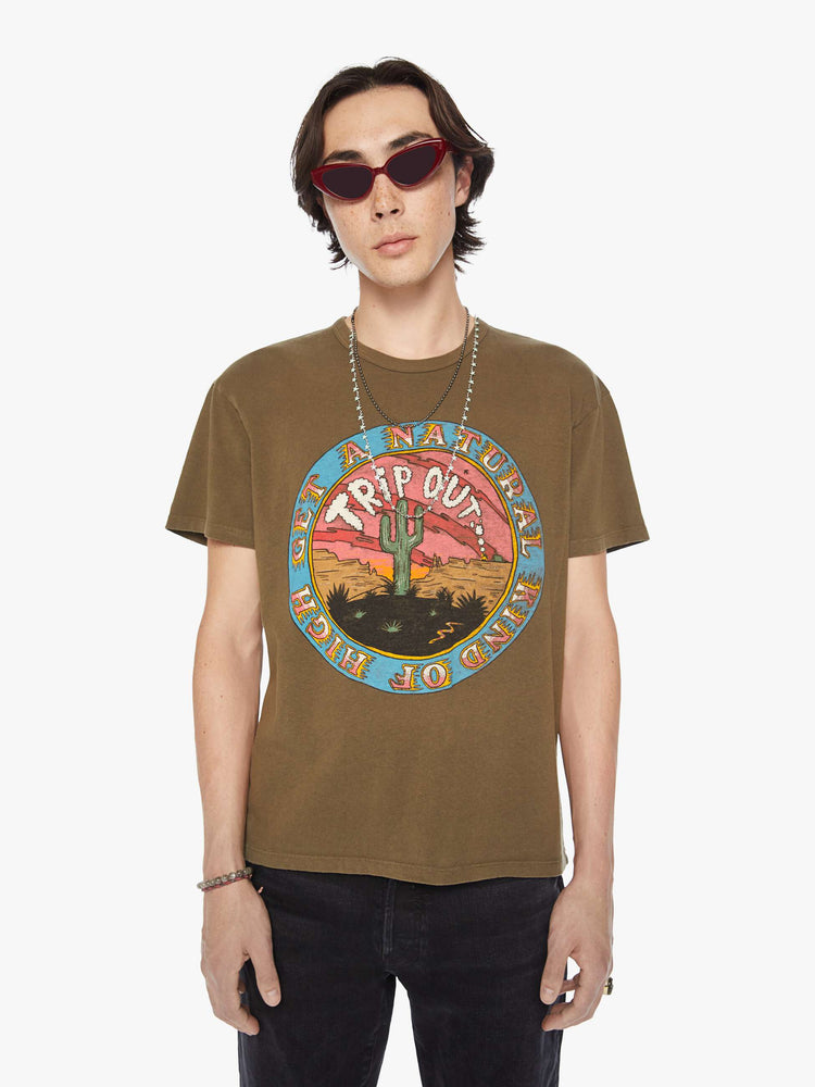 Front view of a men olive-brown hue oversized tee with drop shoulders and a loose fit with a desert themed graphic.