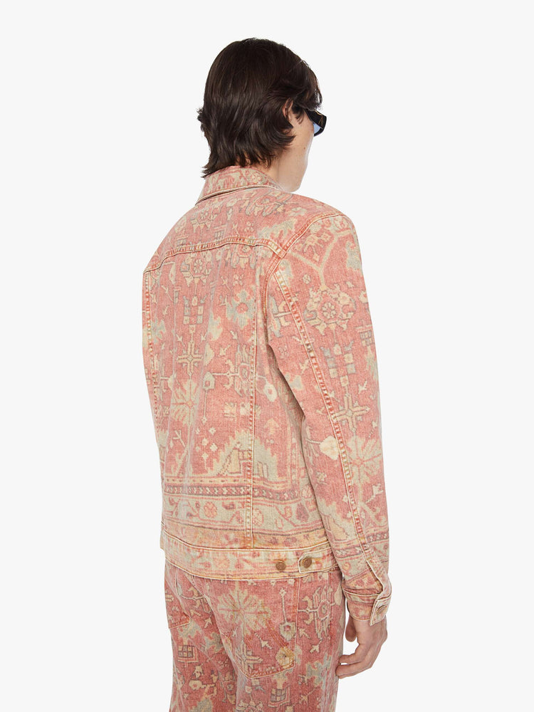 Back view of a men collared jacket with drop shoulders, patch pockets, slit pockets and a slightly shrunken fit in a faded tapestry inspired print.