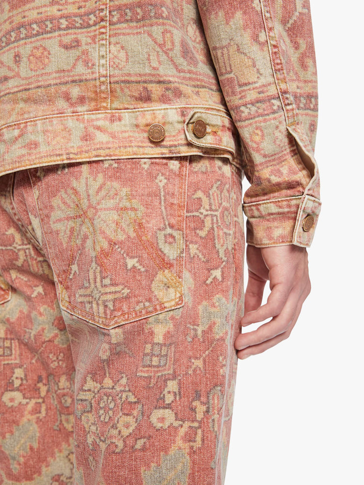 Arm cuff swatch view of a men collared jacket with drop shoulders, patch pockets, slit pockets and a slightly shrunken fit in a faded tapestry inspired print.