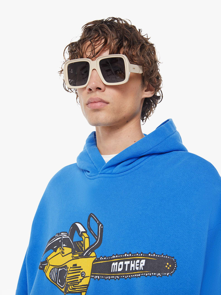 MEN close up view of an oversized hoodie with drop shoulders, ribbed hems and a front patch pocket. 