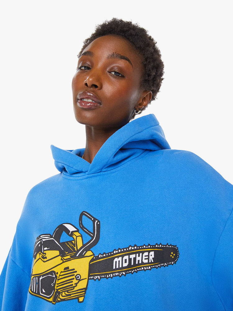WOMAN close up view of an oversized hoodie with drop shoulders, ribbed hems and a front patch pocket. 