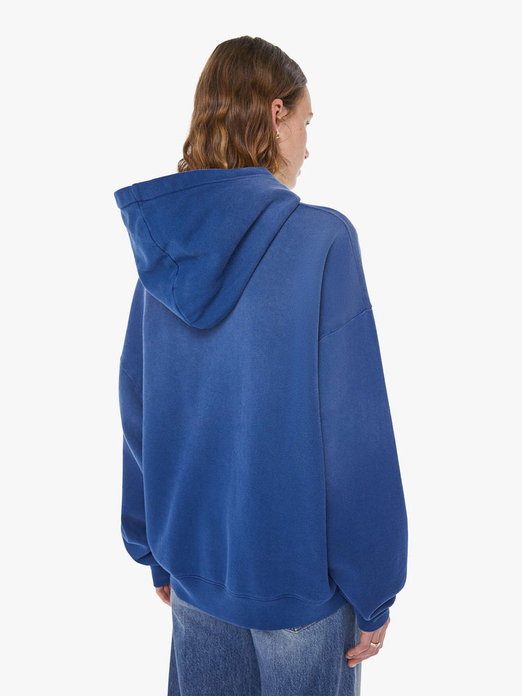 WOMAN back view of a blue  oversized hoodie with drop shoulders, ribbed hems and a front patch pocket.