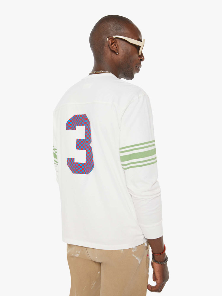 MEN back view in a white rugby-style tee with a crew neck, long sleeves with a checkered "75" graphic on the front, mint-green stripes on the sleeves and a tiger near the neck.