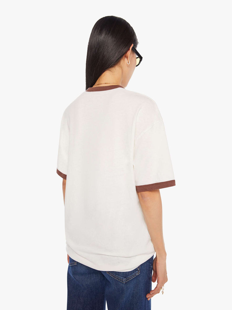 WOMEN back view of an oversized tee with drop shoulders and a loose fit in white with brown trim.