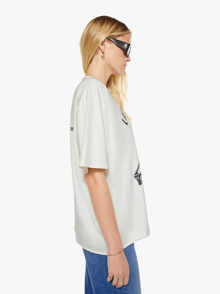 WOMAN side  view of a white tee features a billiards graphic with text on the front.