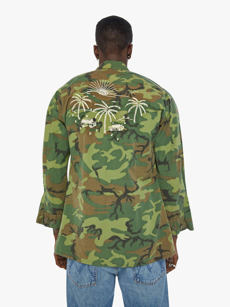 Back view of a mens camo jacket featuring front patch pockets and white embroidery details.