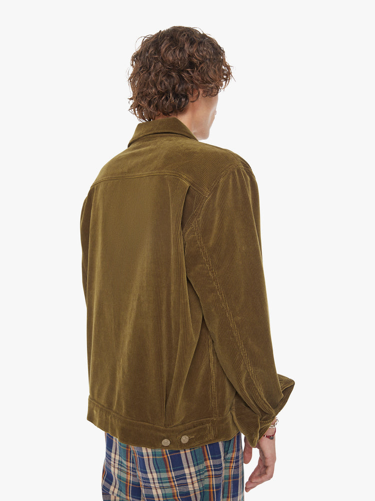 Back view of a man button-up with oversized patch pockets, drop shoulders, extra-long sleeves and a loose fit. 