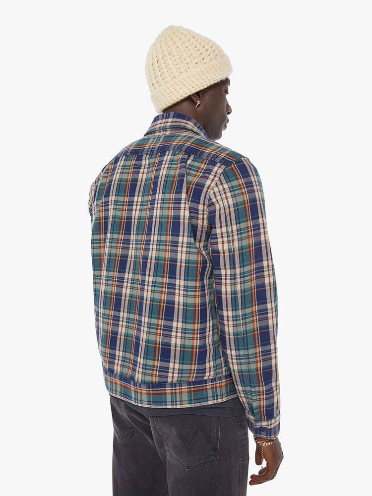 Back view of a man in a plaid print zip-up jacket with patch pockets, long sleeves and a slightly cropped fit. 