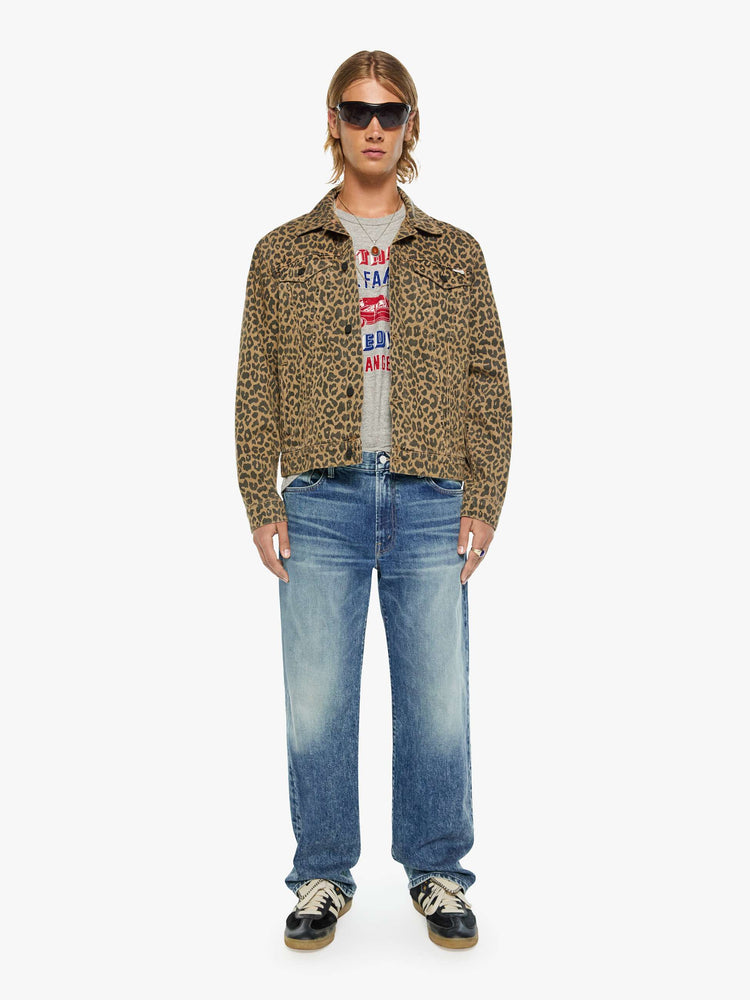 Full body view of a man in a leopard print classic button-up jacket with a collared neck, patch pockets and a boxy fit.
