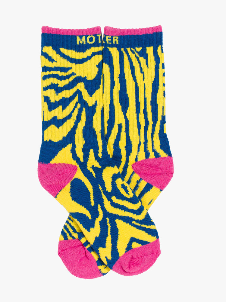Flat view of classic tube socks with an explicit message in a bright yellow and blue zebra print with hot pink details and text in yellow.