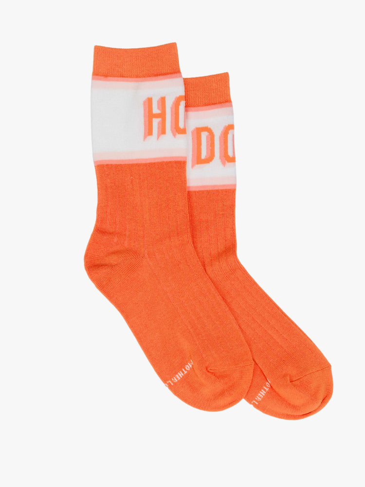Flat view of tube bright orange-red with white and pink stripes and text across the top.