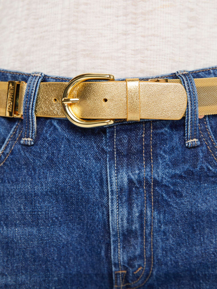 Close up view of a wide belt made from 100% copper chainmail with a rounded gold-tone buckle.