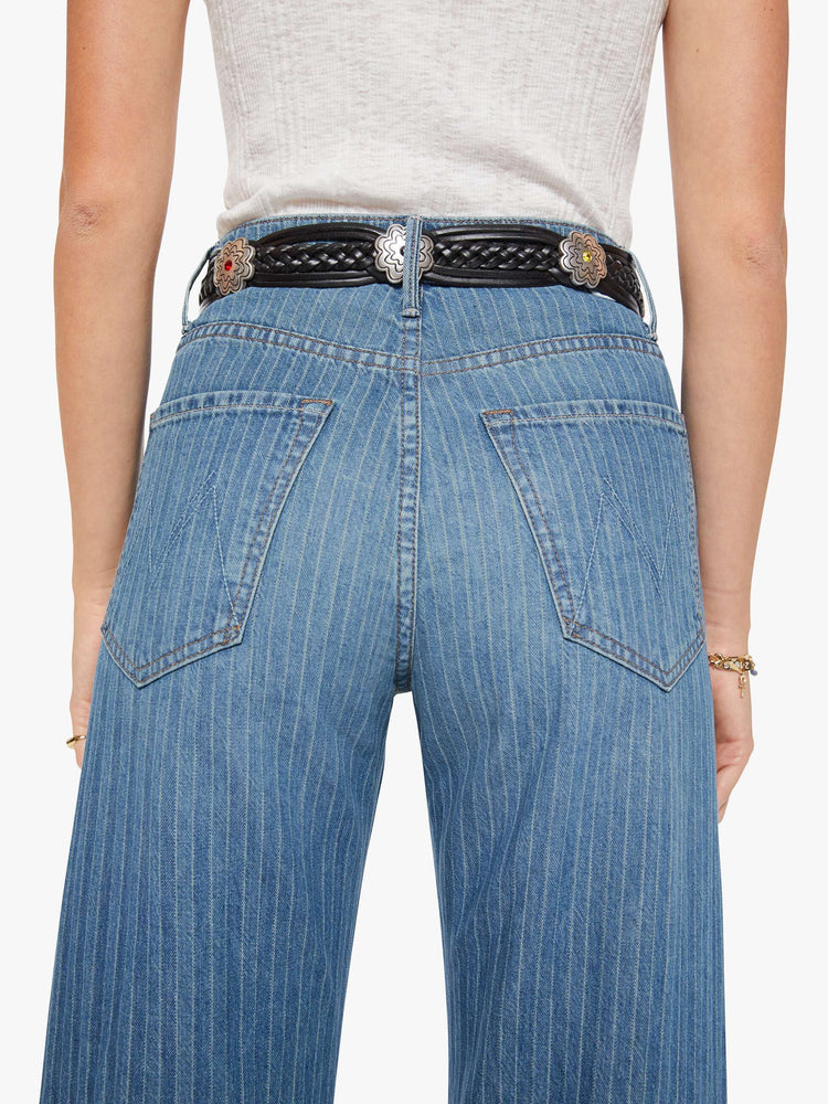Back leather belt with an oversized silver buckle engraved with an explicit message from MOTHER.
