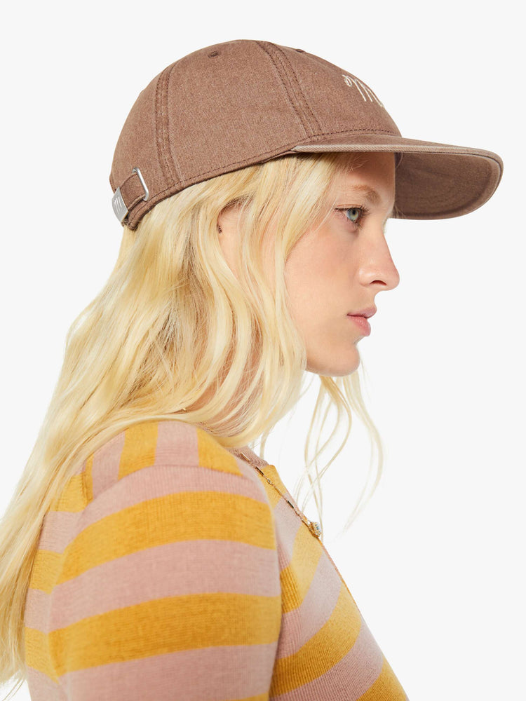 Side on model view of a dad hat designed in faded brown with MOTHER's name embroidered in white cursive on the front.