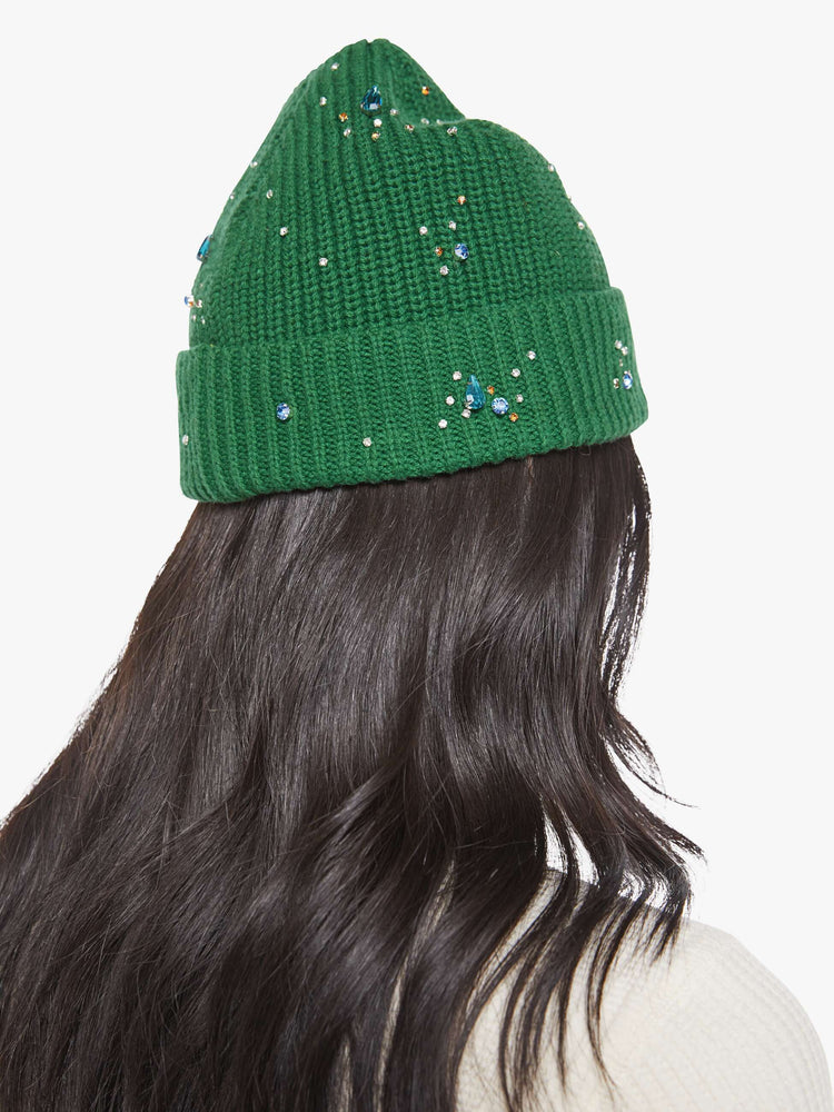 Back view of a green beanie with colorful rhinestone embellishments.