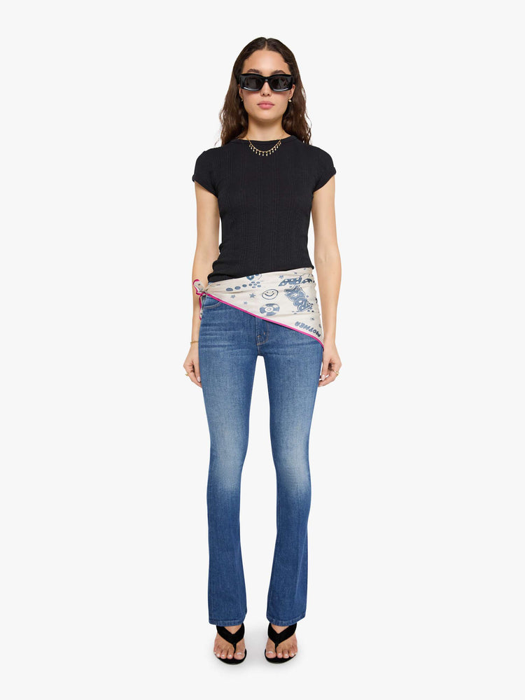On model view of an off-white with hot pink trim and faded blue doodles throughout scarf.