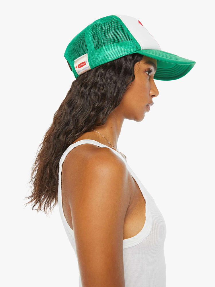 Side of a green and white trucker hat with a strawberry graphic and the word "MOTHER" in red.
