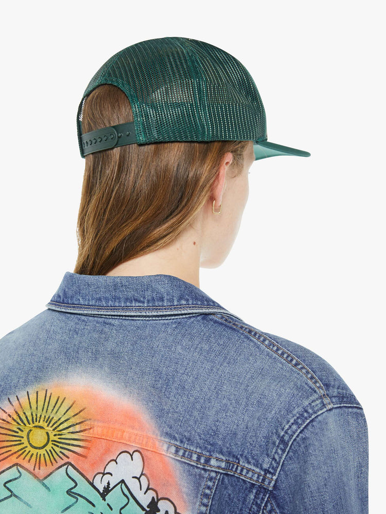 Back view of vintage-inspired hat designed in green featuring retro-inspired pins and MOTHER's name in peach on the front.
