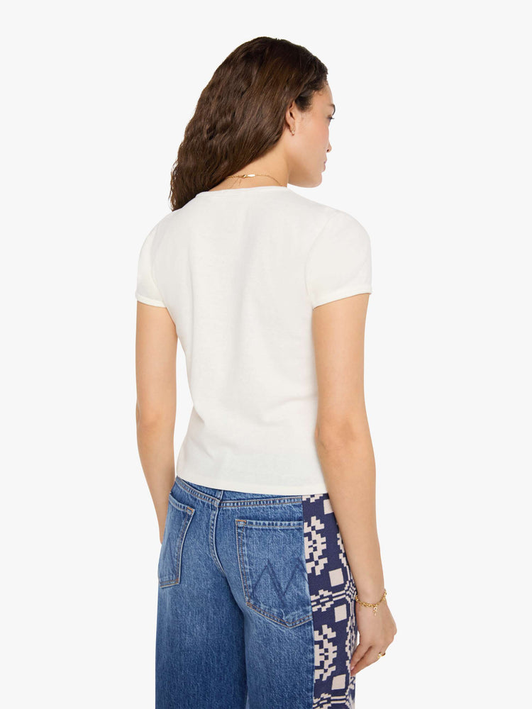 Back view of woman in an off-white tee features a faded, air-brushed tiger graphic and MOTHER's name in black on the front.