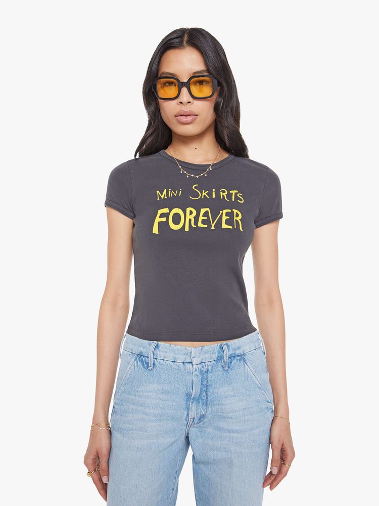 Front view of a  faded black tee with a Mini Skirts Forever features yellow text on the front.