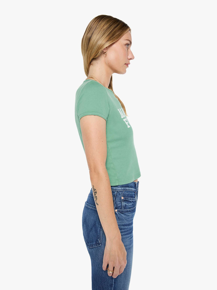 Side view matcha green tee features an explicit text graphic in white on the front.