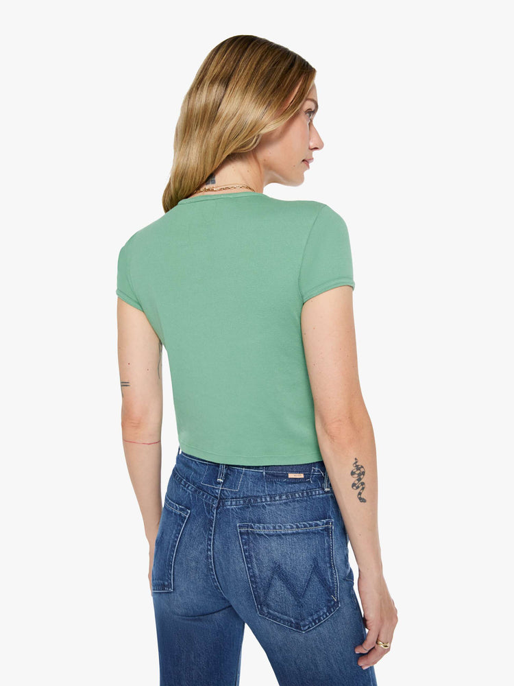 Back view matcha green tee features an explicit text graphic in white on the front.