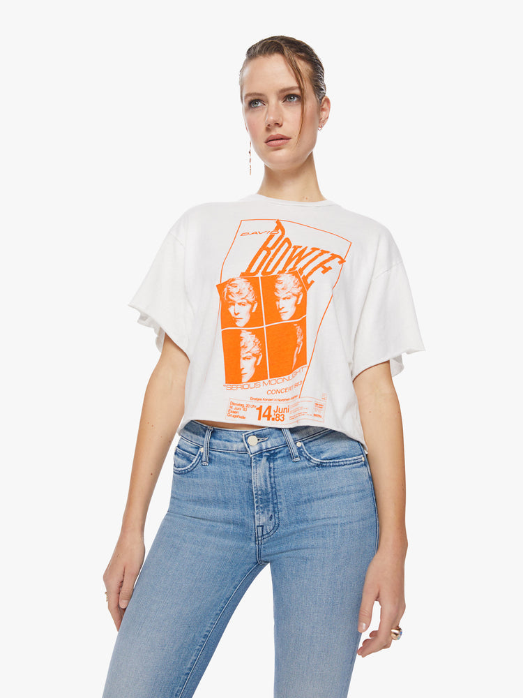 Front view of a woman  oversized cropped tee  pays tribute to the superstar’s 1983 Serious Moonlight Tour, with drop shoulders, subtle bat wings, a raw hem and a boxy fit.