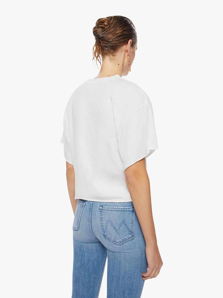 Back view of a woman oversized cropped tee pays tribute to the superstar’s 1983 Serious Moonlight Tour, with drop shoulders, subtle bat wings, a raw hem and a boxy fit.