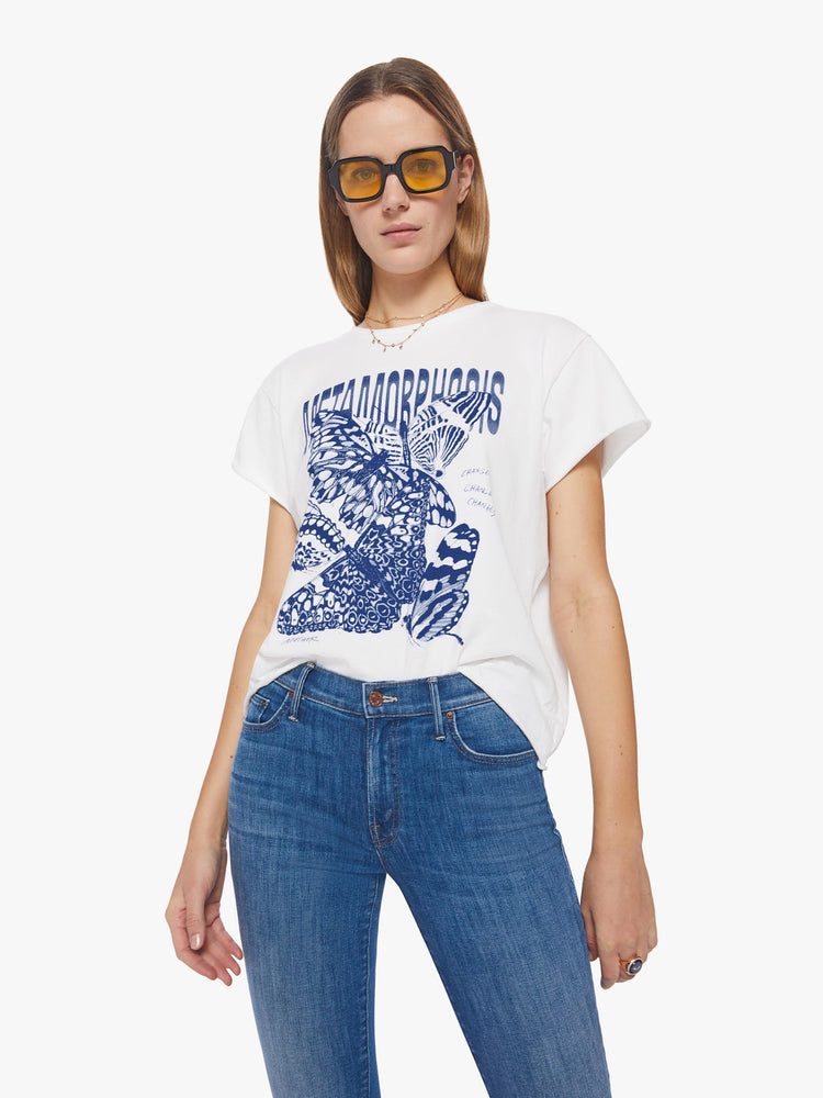Front view of a woman oversized crewneck tee in white that features a bright blue butterfly graphic with text on the front.