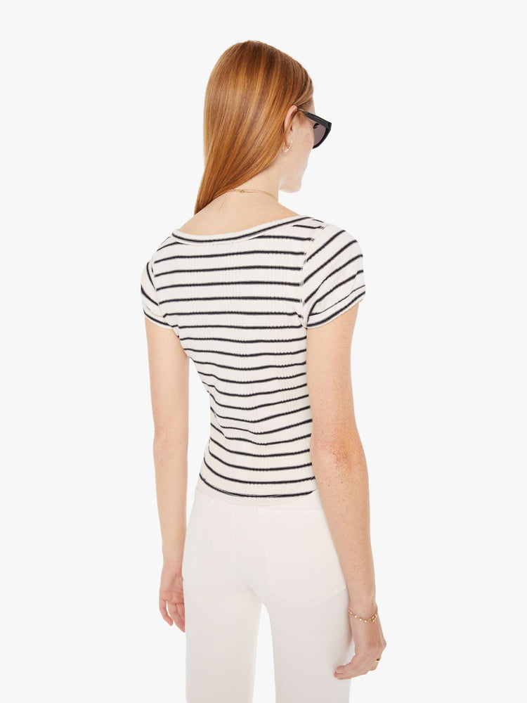Back view of a womens black and white striped fitted scoop neck tee featuring a curved hem.