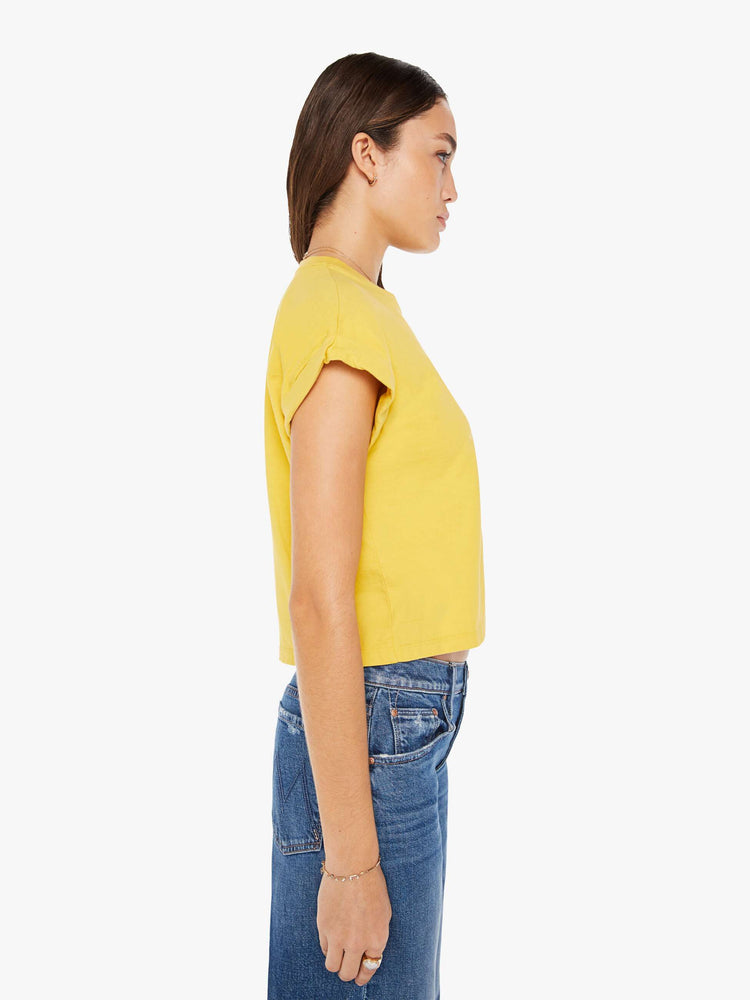 Side view of a womens crew neck tee in yellow featuring a cropped body and front chest pocket.